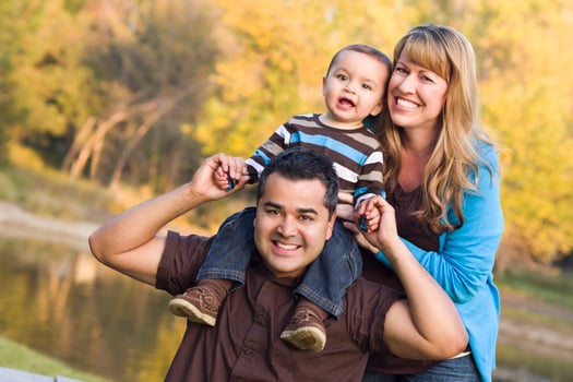 Happy Mixed Race Ethnic Family Posing for A Portrait photo