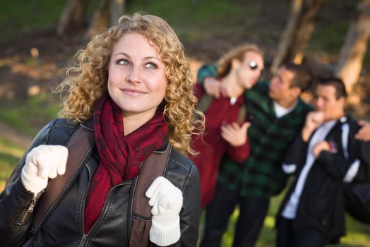 Pretty Young Teen Girl with Boys Behind Admiring Her photo