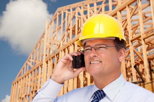 Contractor in Hardhat at Construction Site photo