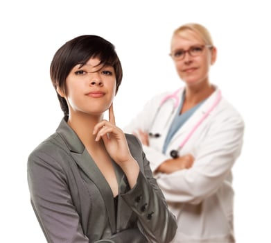 Young Multiethnic Woman and Female Doctor photo