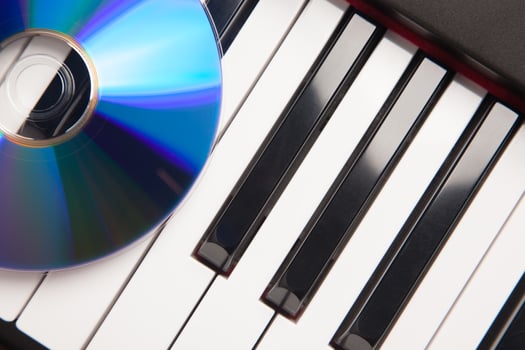 CD Laying on Piano Keyboards Abstract photo