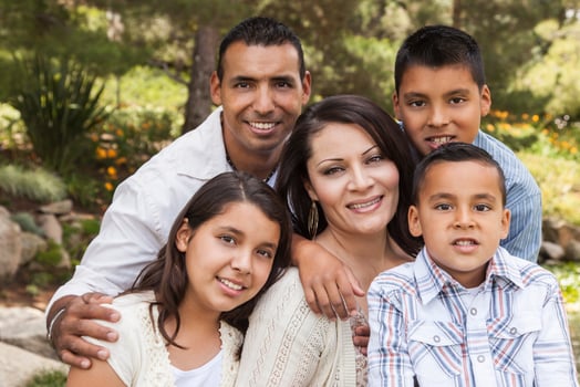 Happy Attractive Hispanic Family Portrait In the Park photo