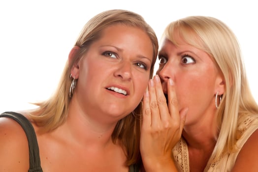 Two Blonde Woman Whispering Secrets photo
