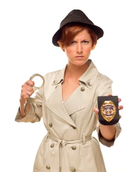 Female Detective With Handcuffs and Badge In Trench Coat photo