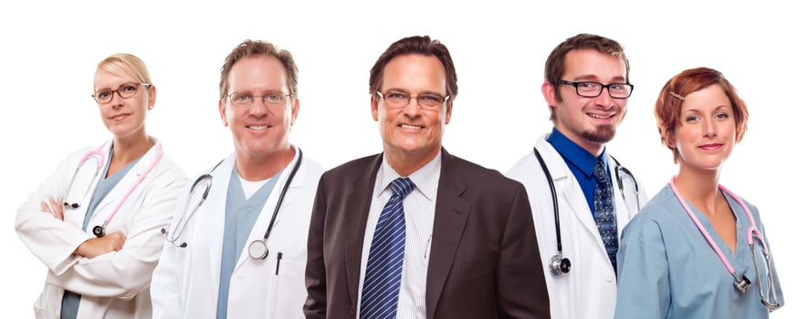 Smiling Businessman with Doctors and Nurses photo