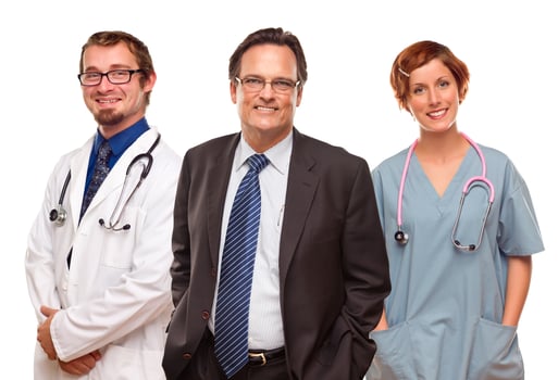 Smiling Businessman with Doctors and Nurses photo