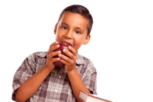 Adorable Hispanic Boy Eating a Large Red Apple photo