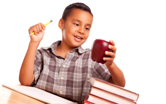 Adorable Hispanic Boy with Books, Apple, Pencil and Paper photo