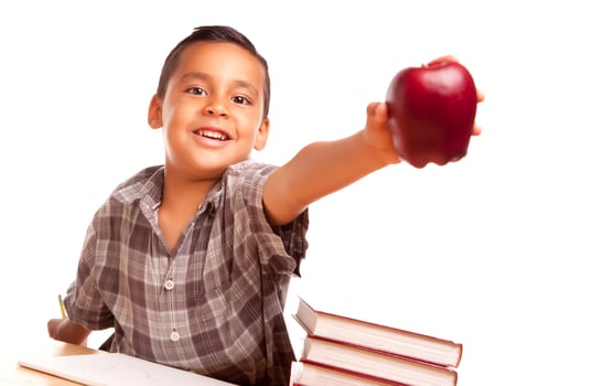Adorable Hispanic Boy with Books, Apple, Pencil and Paper photo