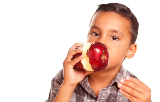 Adorable Hispanic Boy Eating a Large Red Apple photo
