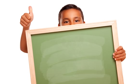 Cute Hispanic Boy Holding Blank Chalkboard photo