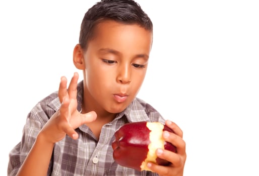 Adorable Hispanic Boy Eating a Large Red Apple photo