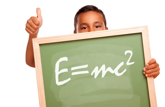 Proud Hispanic Boy Holding Chalkboard with Theory of Relativity photo
