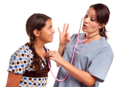 Pretty Hispanic Girl and Female Doctor Isolated photo