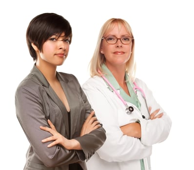 Young Mixed Race Woman with Female Doctor or Nurse on White photo