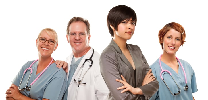 Young Mixed Race Woman with Doctors and Nurses Behind photo