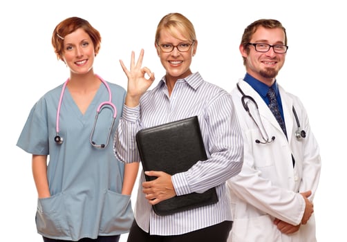 Businesswoman Making Okay Hand Sign with Doctors or Nurses photo