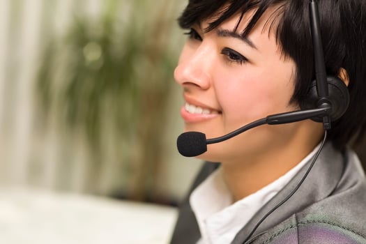 Attractive Young Mixed Race Woman Smiles Wearing Headset photo