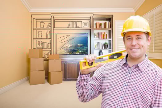 Male Construction Worker In Room With Drawing of Entertainment Unit photo