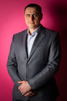 handsome businessman in a suit looks at the camera. photo