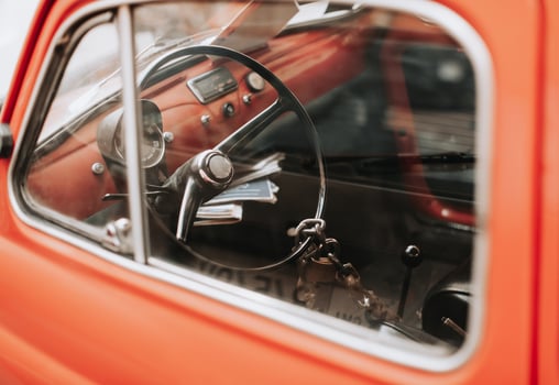 retro car with a beautiful design, the steering wheel is closed with an old lock on a chain. photo