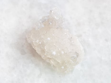 rough crystal of Prehnite with Okenite on white photo