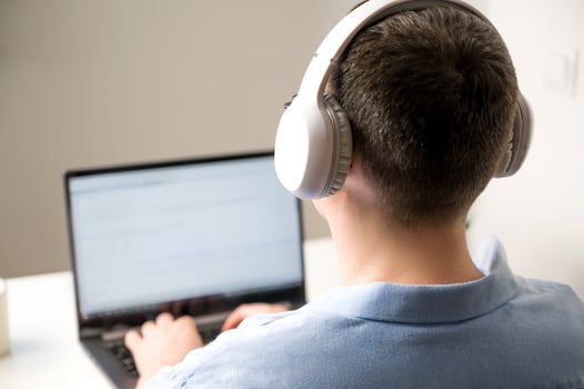 Asian man programming or online shopping using laptop.Selective focus photo