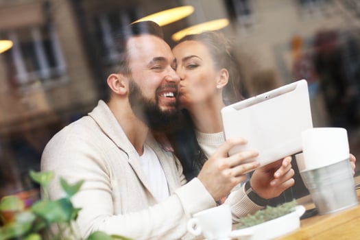 Happy couple using tablet photo