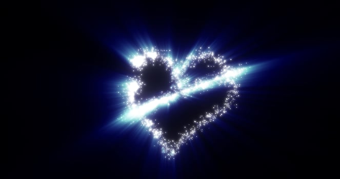 A heart from a flying comet salute love from particles and lines of luminous shiny gold on a blue background for Valentine's Day. Abstract screensaver photo