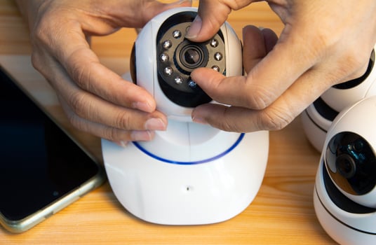 Conceptual man operating ip camera photo