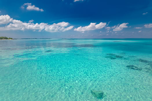 Calm sea and blue sky background. Perfect blue sky with clouds and water of the sea. Nature environment photo