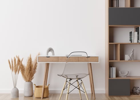 Empty white wall in modern home office. Mock up interior in scandinavian, boho style. Free space, copy space for your picture, poster. Desk, chair, pampas grass, rattan basket. 3D rendering. photo