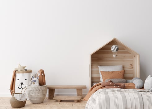 Empty white wall in modern child room. Mock up interior in scandinavian style. Free, copy space for your picture, poster. Bed, rattan basket, toys. Cozy room for kids. 3D rendering. photo
