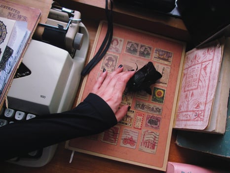 Vintage Desk Top Setting With Old Books And Typewriter photo