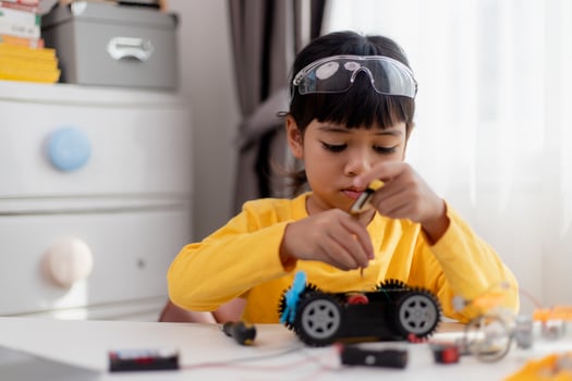 Asia students learn at home in coding robot cars and electronic board cables in STEM, STEAM, mathematics engineering science technology computer code in robotics for kids concept. photo