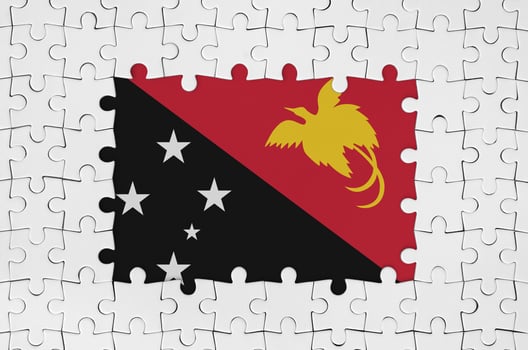 Papua New Guinea flag in frame of white puzzle pieces with missing central part photo
