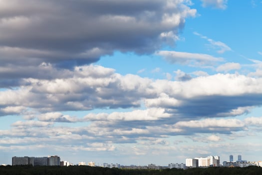 shadow of grey clouds on urban street in spring photo