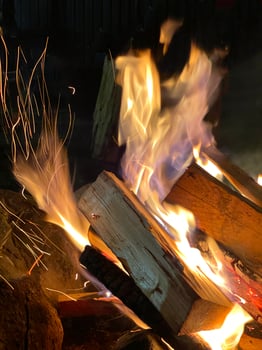 The flame of a bonfire burning in the dark photo