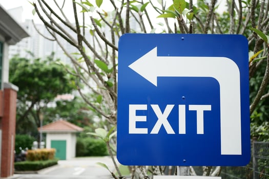 exit sign on brick wall photo