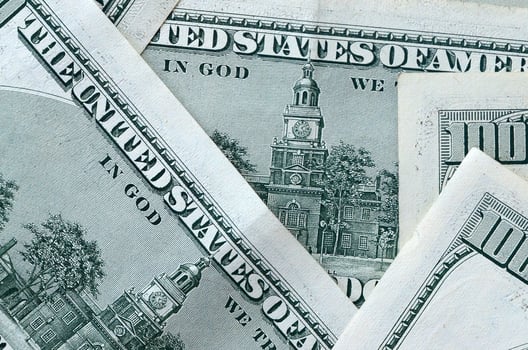 Abstract backdrop with many hundred dollar bills close up photo