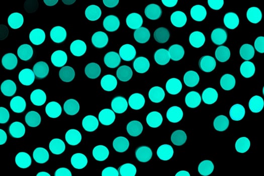 Unfocused abstract colourful bokeh black background. defocused and blurred many round blue light photo
