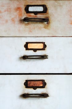 Old metal cabinet with drawers blue color with rusty. photo