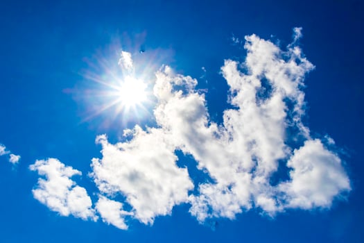 The sun comes out from behind the clouds in Mexico. photo