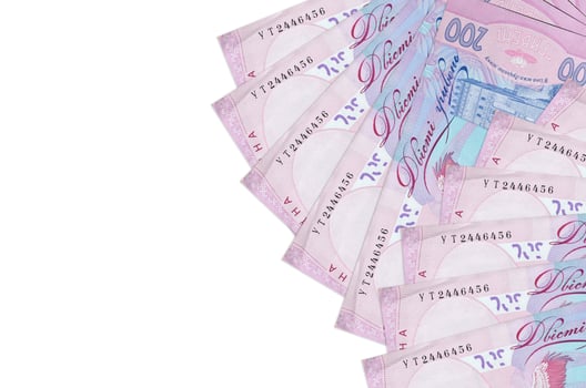 200 Ukrainian hryvnias bills lies isolated on white background with copy space. Rich life conceptual background photo