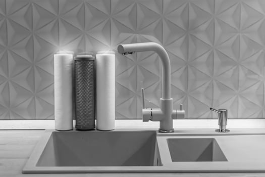 water filter cartridge for home on background kitchen photo
