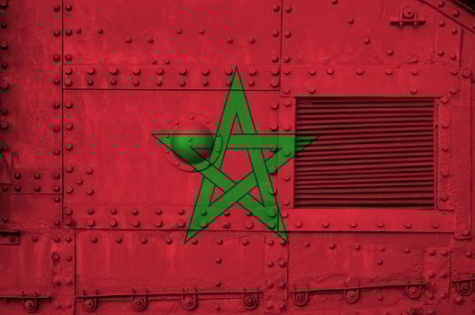 Morocco flag depicted on side part of military armored tank closeup. Army forces conceptual background photo