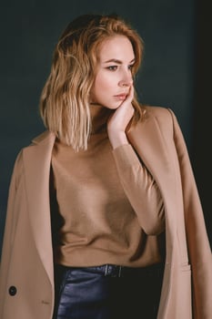 Portrait of young attractive pretty blonde woman in the beige jacket photo