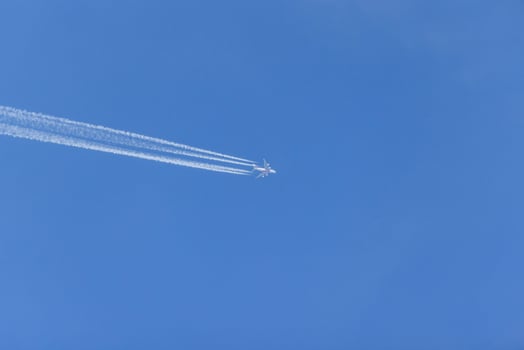 Close-up of a flying commercial aircraftat high altitude photo