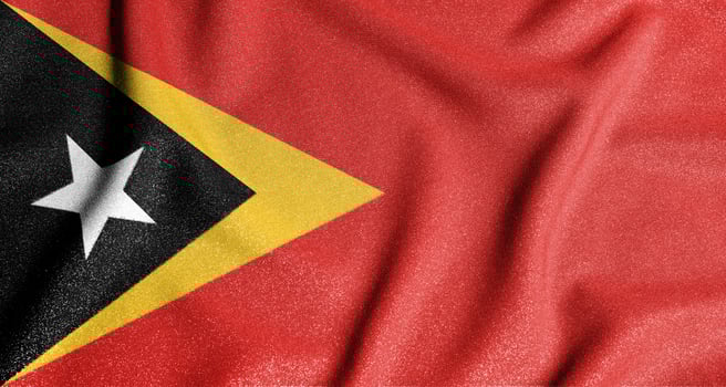 National flag of the east timor. The main symbol of an independent country. Flag of east timor. An attribute of the large size of a democratic state. photo