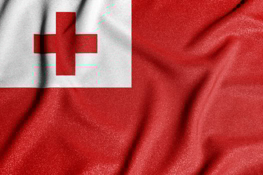 National flag of the tonga. The main symbol of an independent country. Flag of tonga. An attribute of the large size of a democratic state. photo